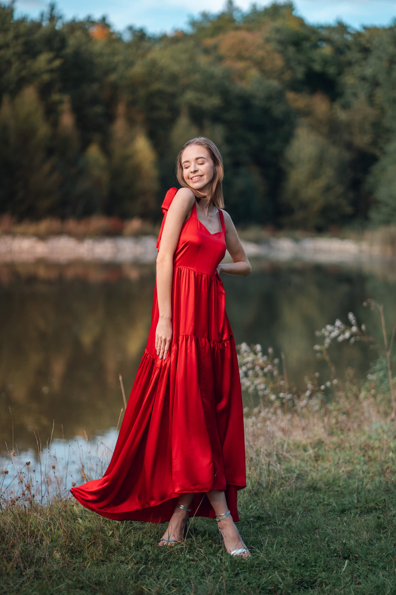 Beautiful red silk maxi dress with tiers and bows. Smiling