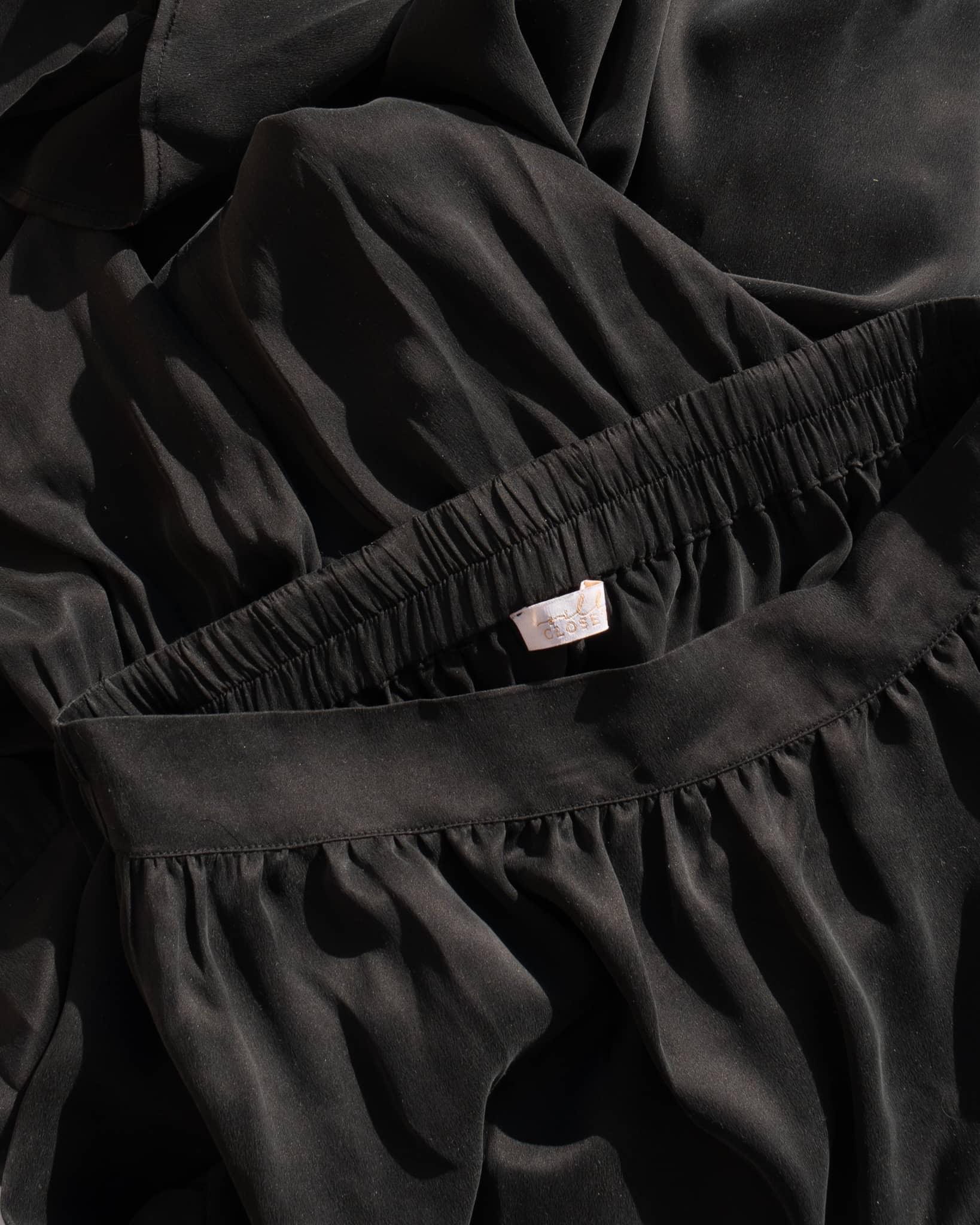 Silk Closet black silk skirt close up