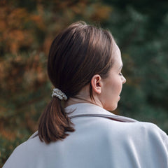 Woman wearing Silk Closet cream scrunchie