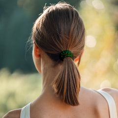 Woman wearing Silk Closet emerald green hair scrunchie