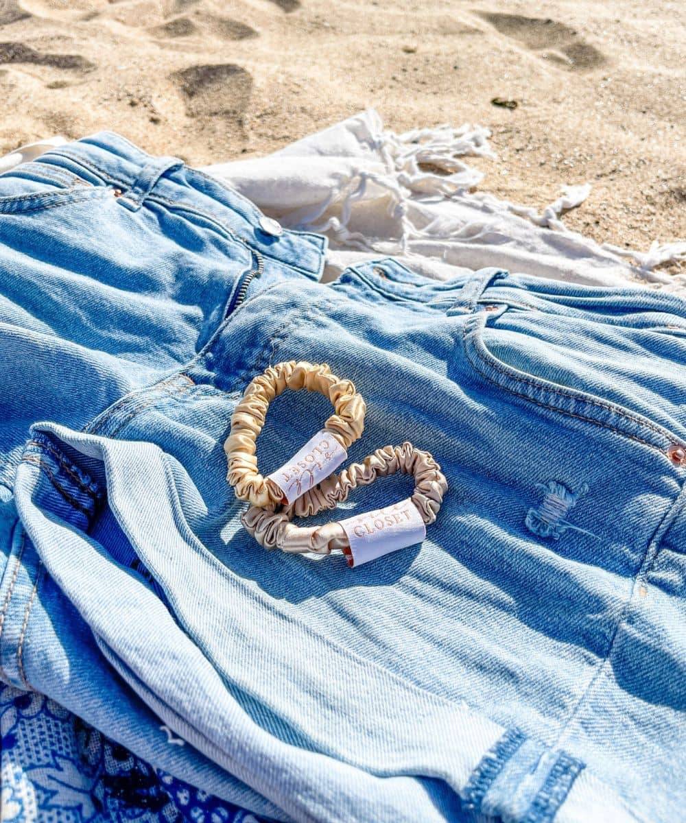 Gold and cream silk hair scrunchies at beach