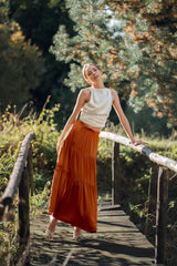 Woman wearing Silk Closet Orange Brown Tiered Maxi skirt.