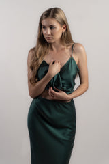 Woman wearing silk closet green skirt and camisole top